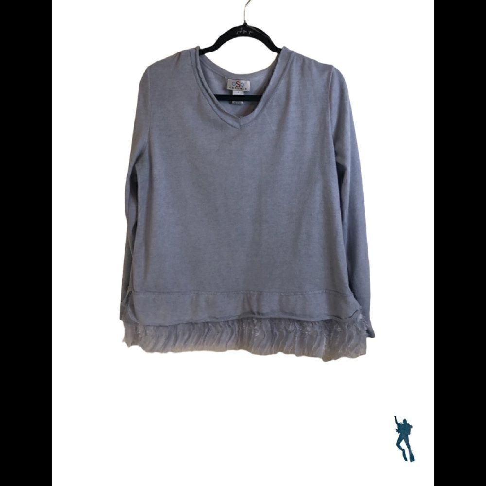 OSO casual wear. Baby blue top with eye lash ruffle on bottom of top. LARGE